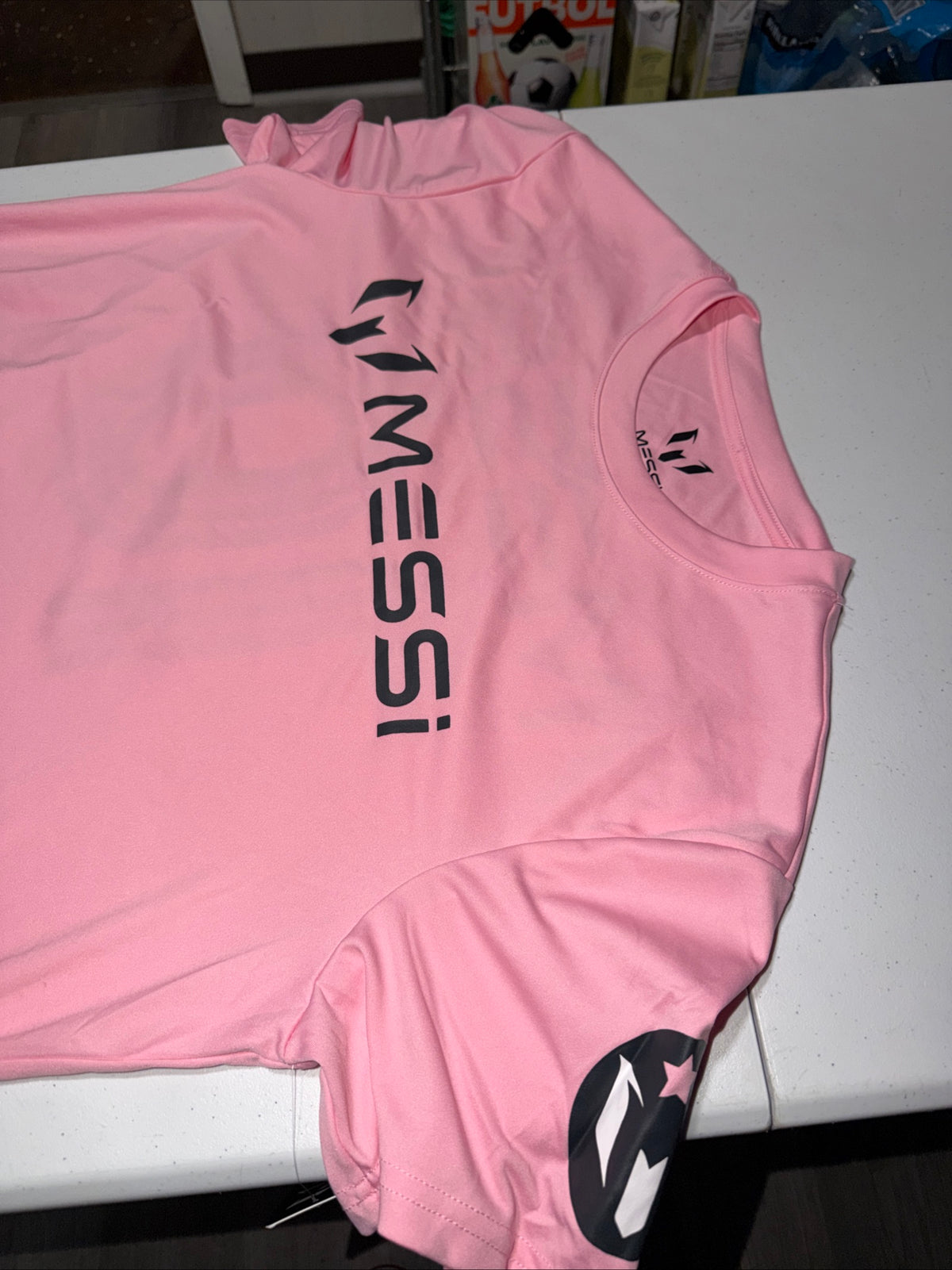 Pink Adidas Messi Jersey Top Features a prominent black logo graphic Size M