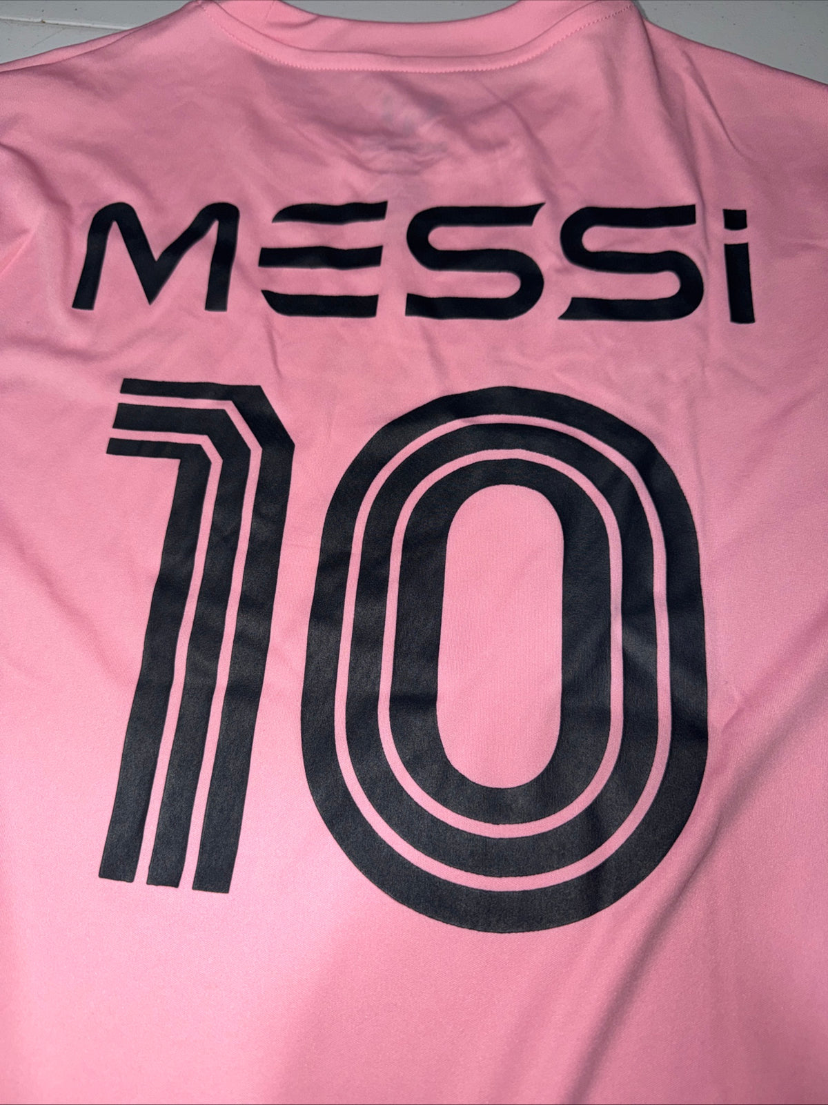 Pink Adidas Messi Jersey Top Features a prominent black logo graphic Size M