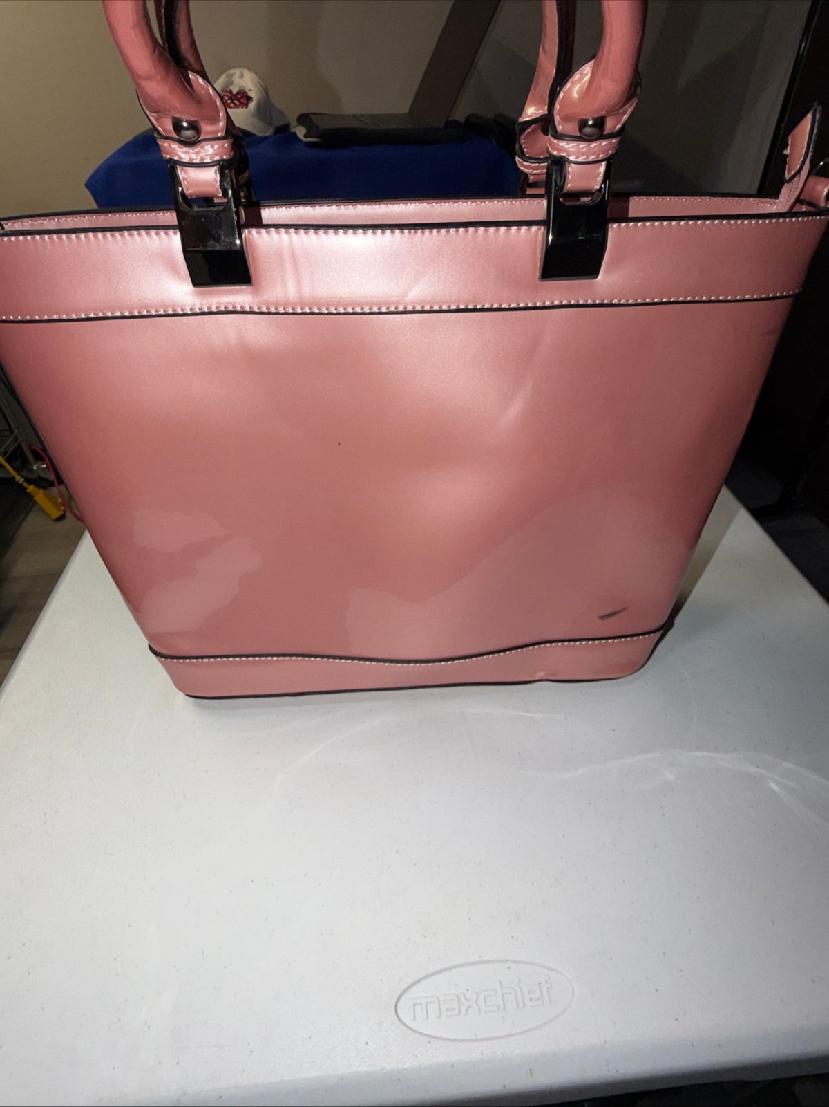 A Iridescent Glossy Pink Plastic Tote Bag with Handles